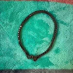 Elegant Black Man’s tennis bracelet